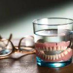 Do I need to remove dentures at night?